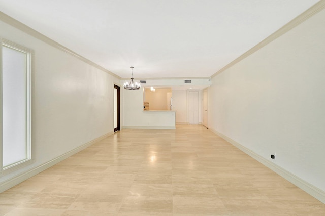 interior space with ornamental molding and a chandelier