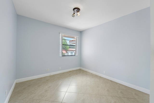 spare room featuring light tile patterned floors