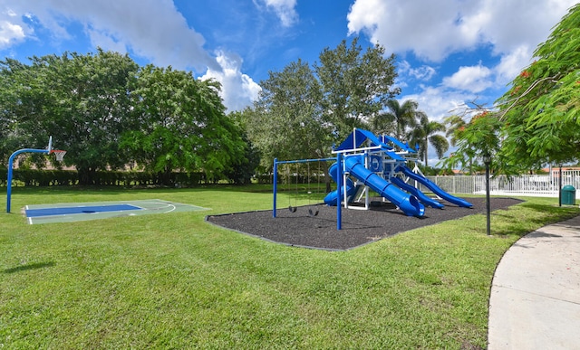 view of jungle gym with a yard and basketball hoop