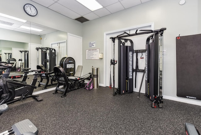 gym featuring a paneled ceiling