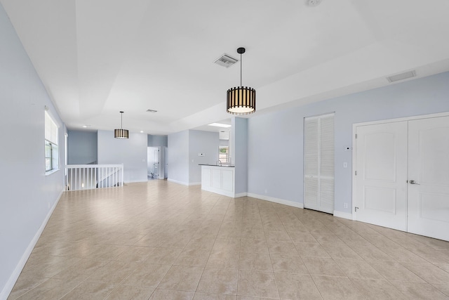 unfurnished living room with light tile patterned flooring