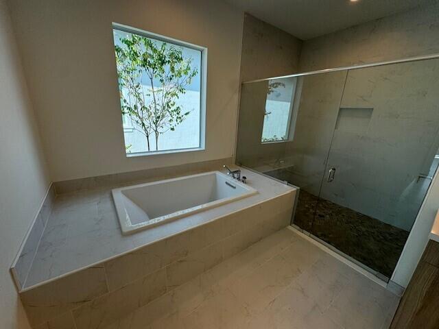 kitchen with white cabinets, sink, and pendant lighting