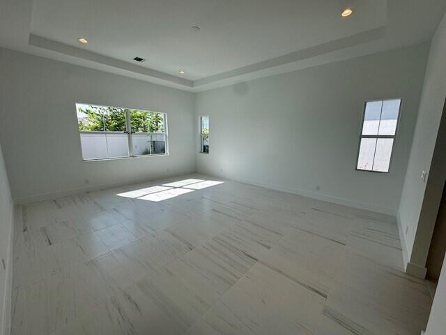 bathroom with a wealth of natural light, vanity, and plus walk in shower