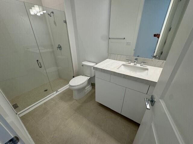 bathroom featuring an enclosed shower and vanity