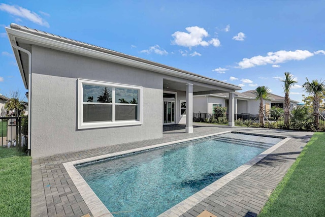 view of pool featuring a patio