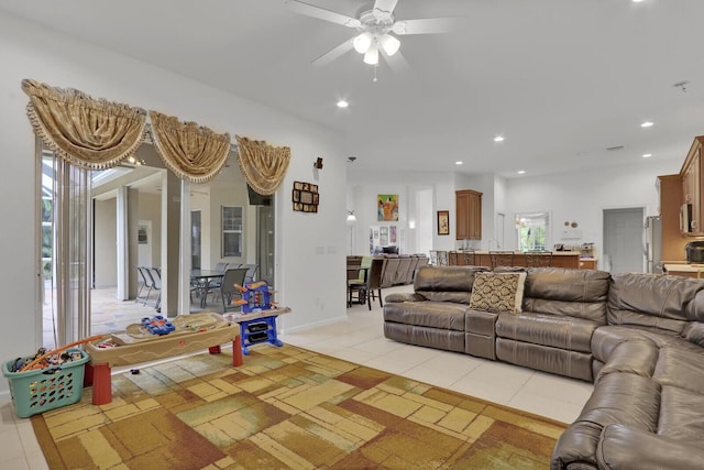 tiled living room featuring ceiling fan