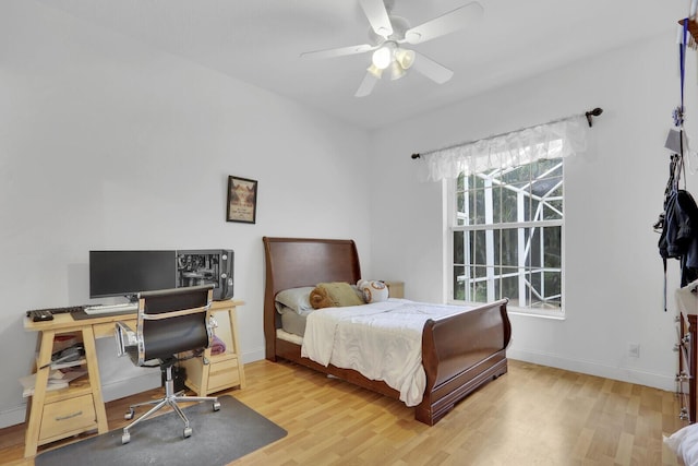 bedroom with hardwood / wood-style floors and ceiling fan