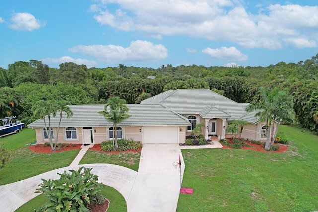 single story home with a front yard and a garage