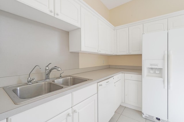 kitchen featuring white cabinetry, sink, white appliances, and light tile patterned flooring