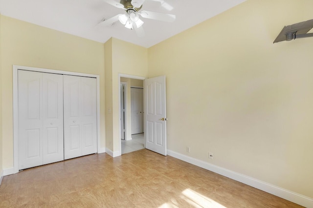 unfurnished bedroom with a closet, ceiling fan, and light wood-type flooring