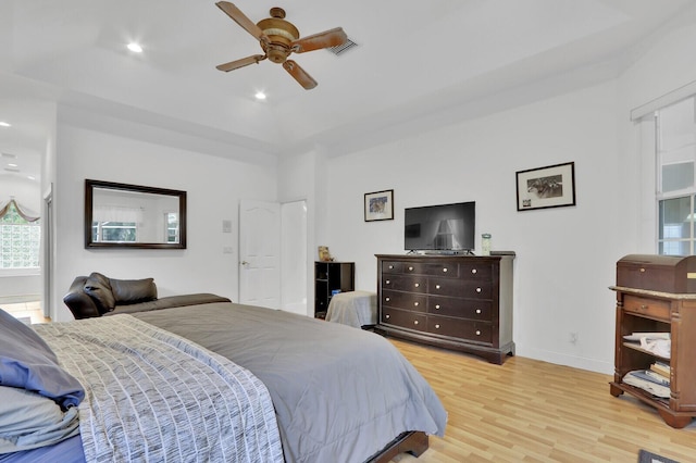 bedroom with ceiling fan and light wood-type flooring