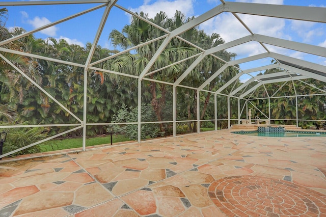 view of patio / terrace with glass enclosure and a swimming pool with hot tub