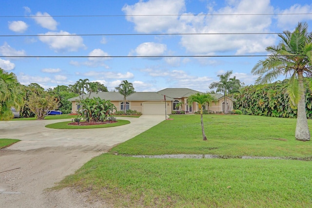 ranch-style house with a garage and a front yard