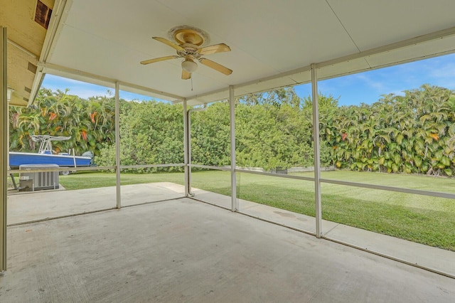 unfurnished sunroom featuring ceiling fan