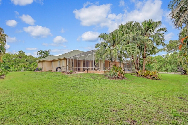 view of yard featuring a lanai