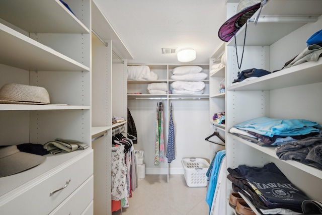 walk in closet featuring light tile patterned floors