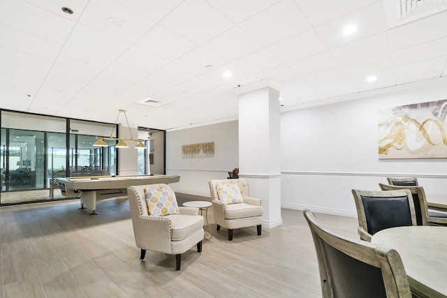 interior space with floor to ceiling windows, light hardwood / wood-style flooring, and billiards