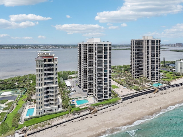 bird's eye view featuring a beach view and a water view