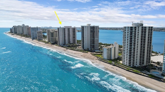 aerial view with a water view and a view of the beach