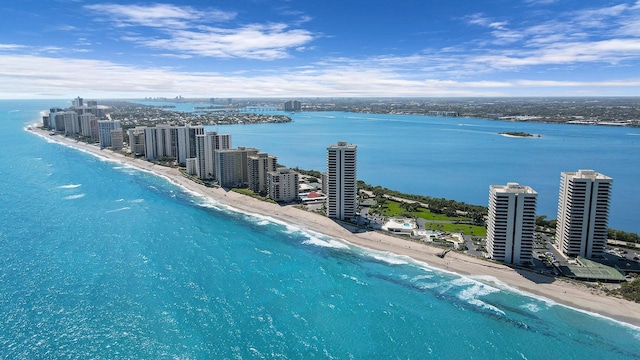 birds eye view of property featuring a water view and a view of the beach