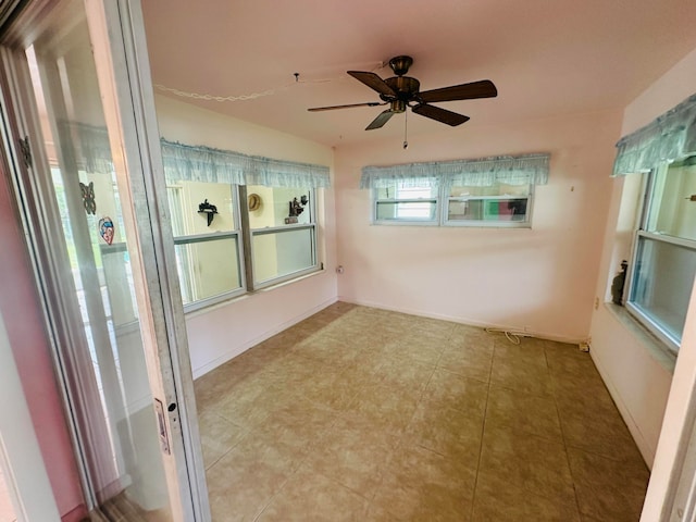 unfurnished room with ceiling fan