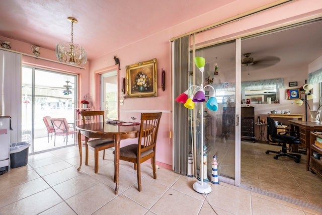 dining area featuring ceiling fan and light tile patterned floors