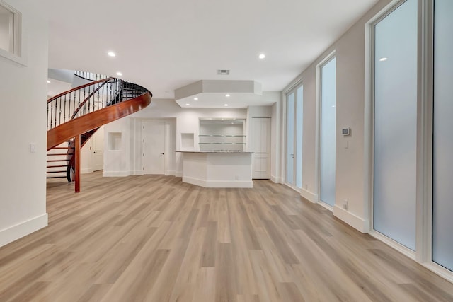 living room with light hardwood / wood-style flooring