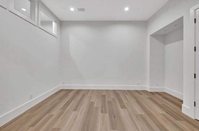 spare room with light hardwood / wood-style floors