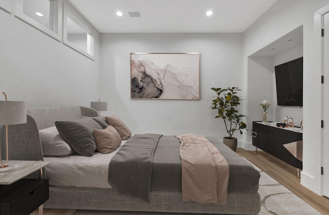 bedroom with light hardwood / wood-style floors