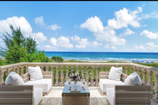 wooden terrace featuring a water view and an outdoor living space