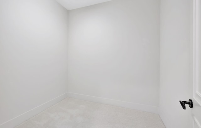 unfurnished room with light colored carpet