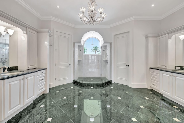 bathroom with vanity, tile patterned floors, a chandelier, ornamental molding, and a shower with door