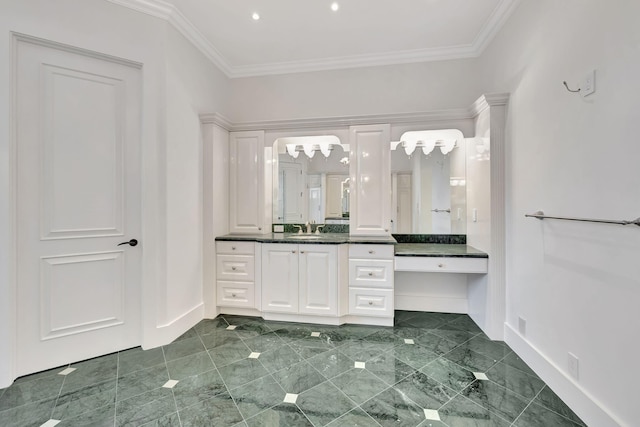 bathroom featuring tile patterned flooring, crown molding, and vanity