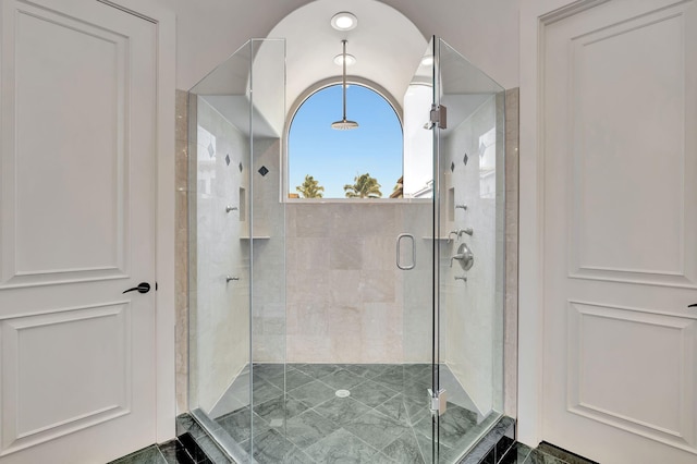 bathroom with walk in shower and tile patterned floors