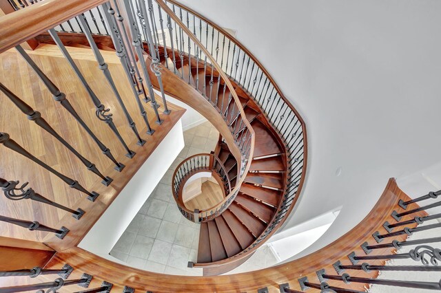 staircase featuring tile patterned floors