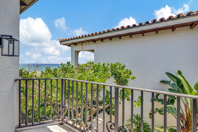 balcony featuring a water view