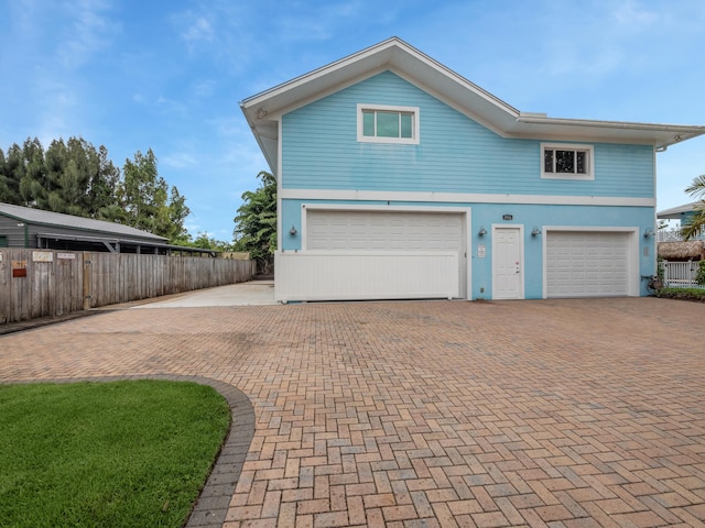 front of property with a garage