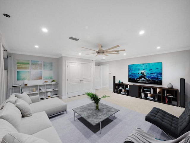 carpeted living room with ceiling fan and crown molding