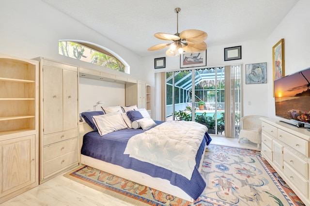 bedroom featuring access to exterior, light hardwood / wood-style flooring, and ceiling fan