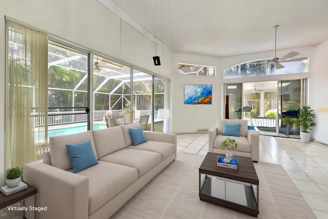 sunroom / solarium featuring ceiling fan