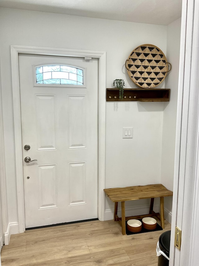 doorway to outside with light wood-type flooring