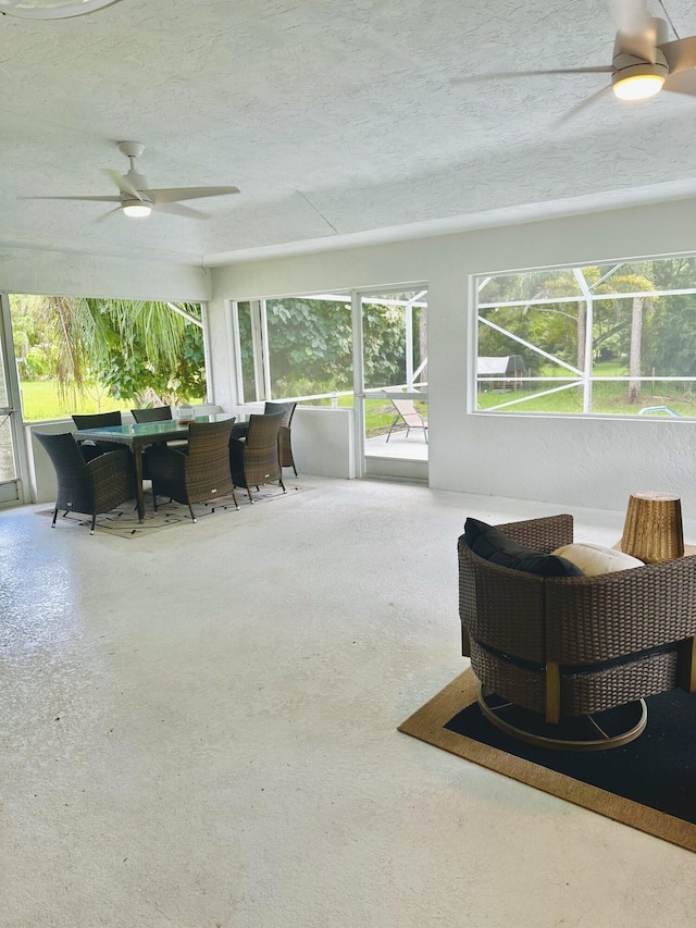 sunroom / solarium with ceiling fan