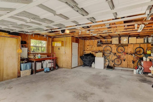 garage featuring wood walls