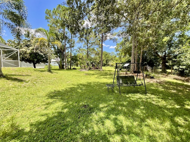 view of yard with a lanai