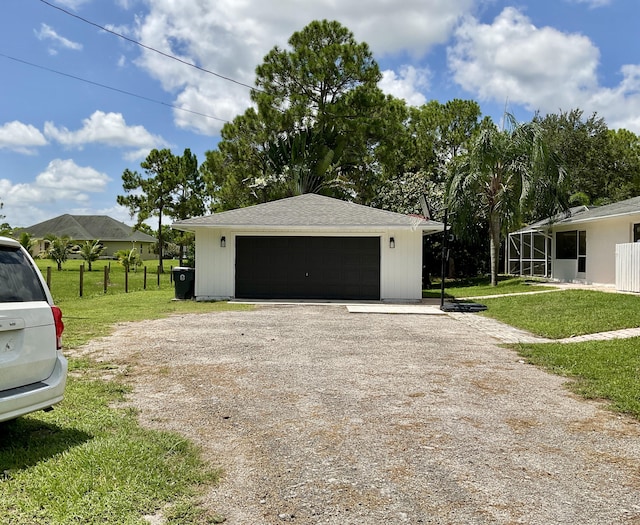 garage with a yard