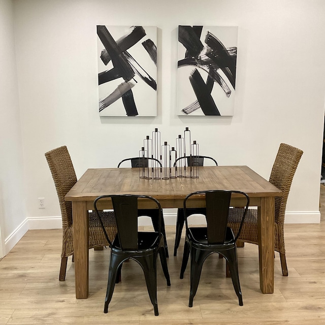 dining space featuring light hardwood / wood-style flooring