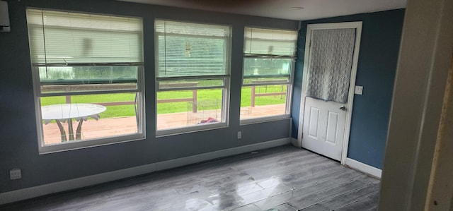 doorway to outside with hardwood / wood-style flooring