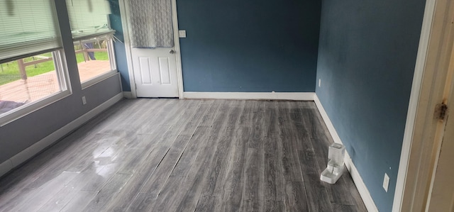 unfurnished room featuring hardwood / wood-style flooring