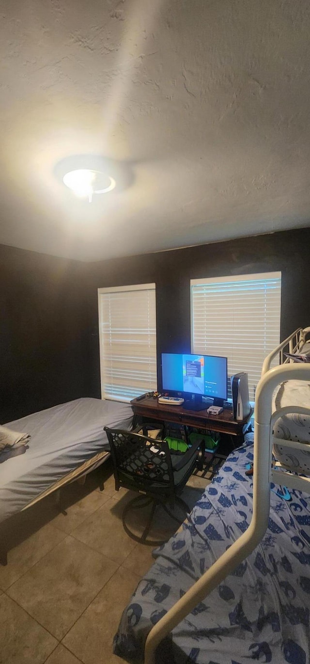 bedroom featuring tile patterned flooring