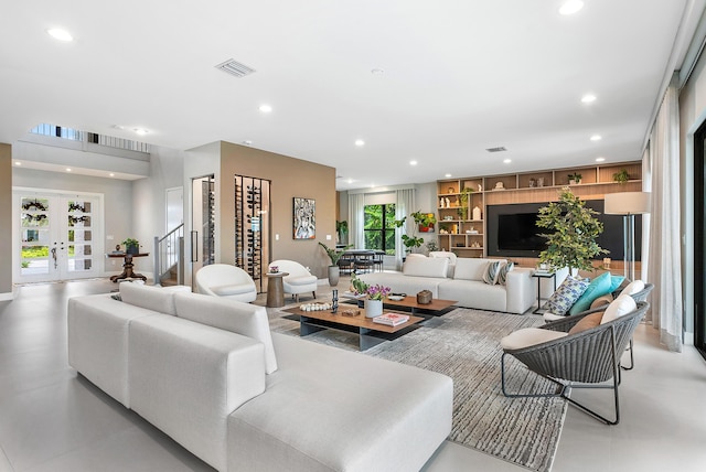 living room with french doors and built in features